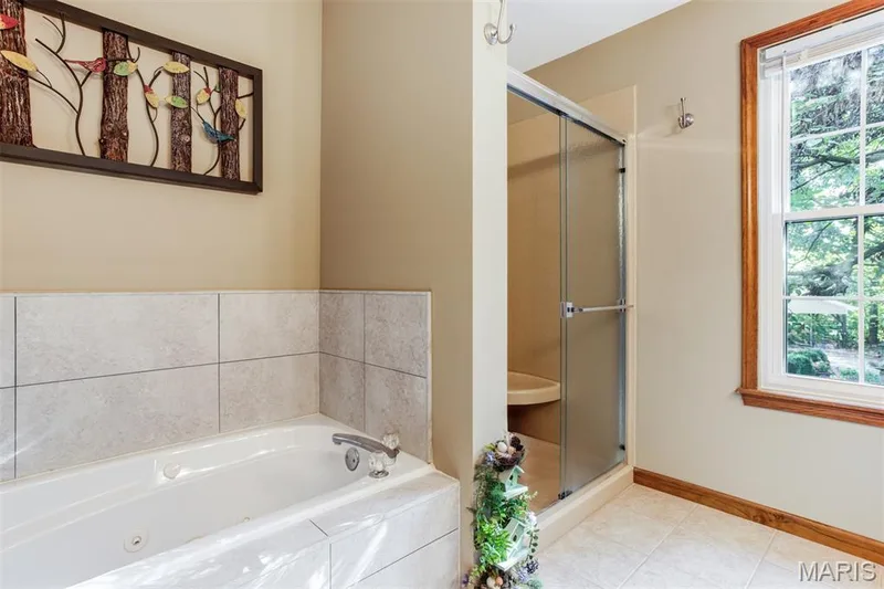 Full bath upper level offers tub and separate shower — 51 Nordic Lane, Defiance, MO 63341