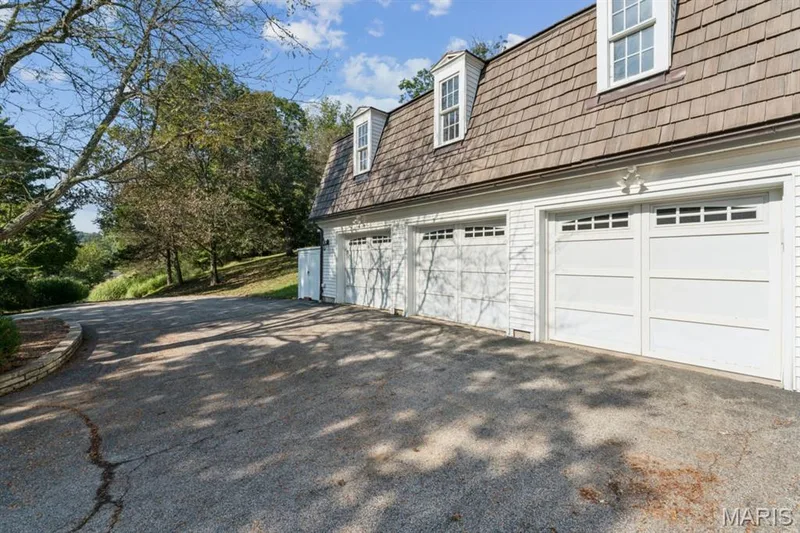 Two white garage doors with transom-style windows — 2333 Ossenfort Road, Wildwood, MO 63038