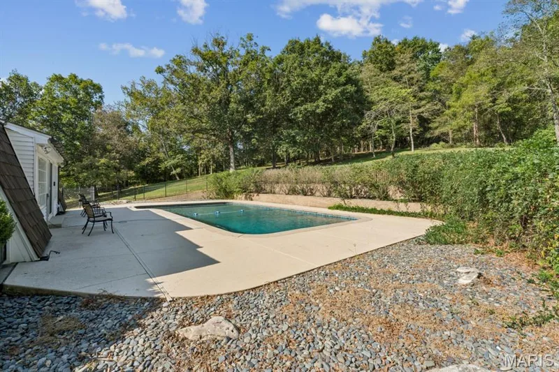 In-ground swimming pool with a concrete surround — 2333 Ossenfort Road, Wildwood, MO 63038
