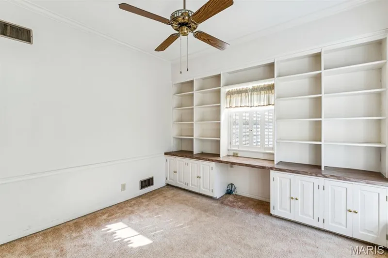 Custom built-in shelving and cabinetry with wood-finish countertops — 2333 Ossenfort Road, Wildwood, MO 63038