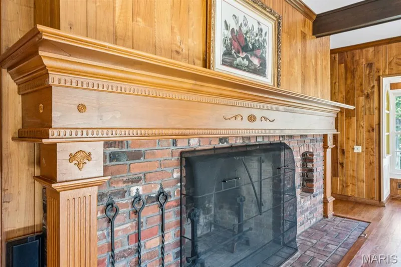 Double-sided brick fireplace with an ornate wood mantel — 2333 Ossenfort Road, Wildwood, MO 63038