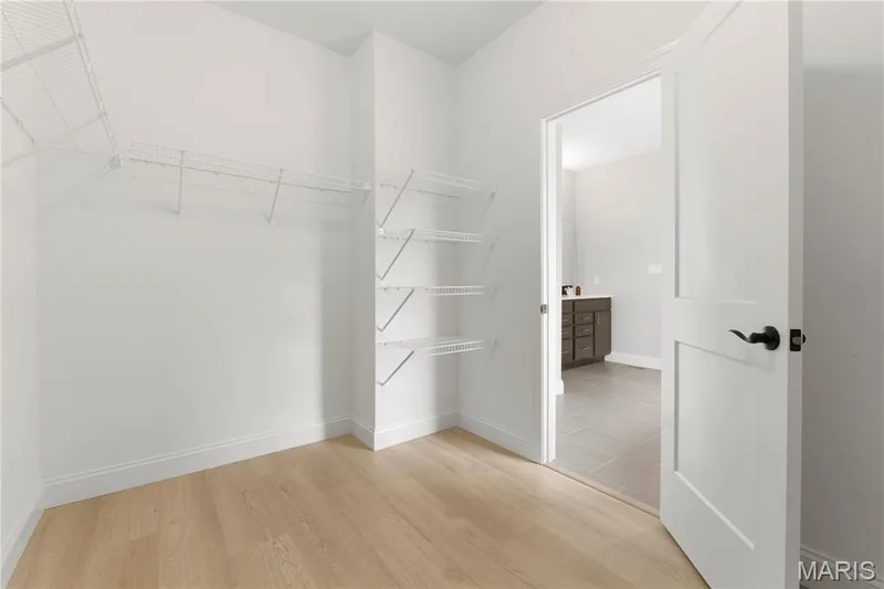 Primary bedroom walk-in closet — 325 Healthy Way, St Charles, MO 63304