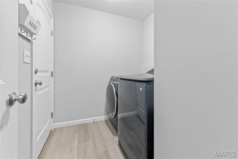 Main floor laundry w/ door to garage. — 1010 Timber Bluff Drive, Wentzville, MO 63385