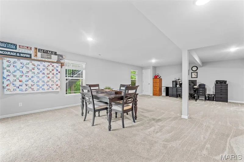 Rec and Living Room area w/ recessed lighting, lots of space and a walk out to the back yard. — 1010 Timber Bluff Drive, Wentzville, MO 63385