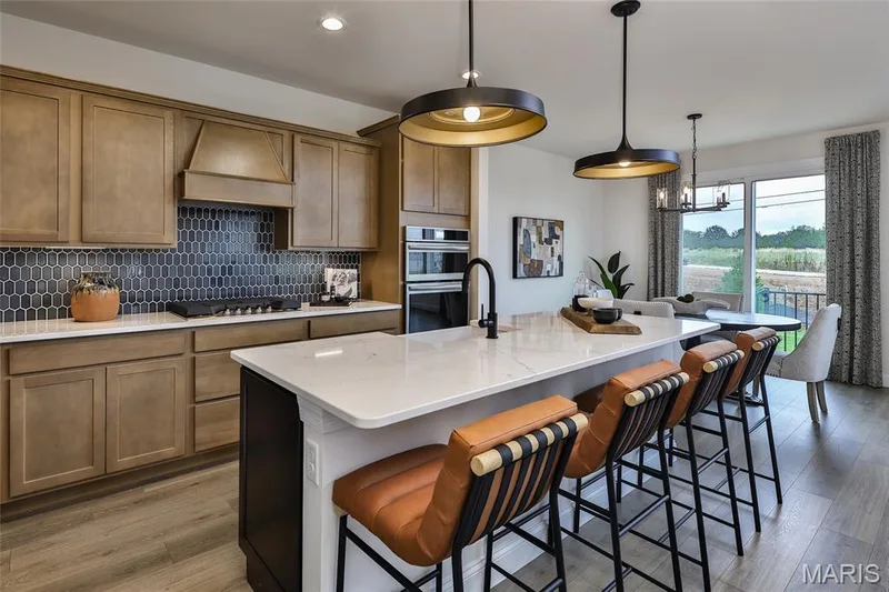 Luxury Kitchen with Built-in Staintless Steel appliances, Custom two-tone cabinets with Quartz countertops — 128 Cedarstone Drive, Dardenne Prairie, MO 63368