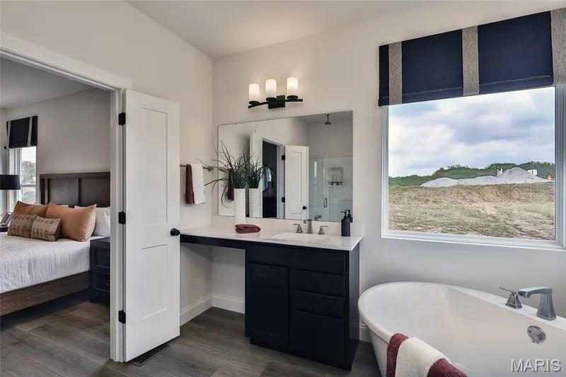 Luxury Primary Bathroom with Culture Marble Shower, Double Rectacular Wave bowls, and soaking tub — 128 Cedarstone Drive, Dardenne Prairie, MO 63368