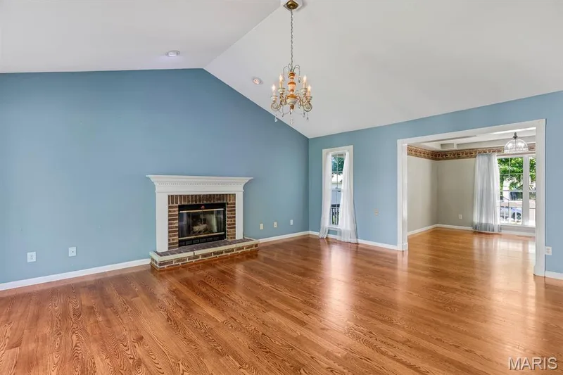 Vaulted Great Room flows to the Dining room and Kitchen for a open concept feel — 1103 Panda Court, Wentzville, MO 63385