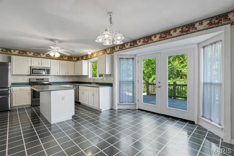 Spacious Kitchen and Breakfast room with bay windows/door let so much natural light in. A real gathering place! — 1103 Panda Court, Wentzville, MO 63385
