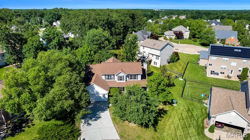 Traditional-style Story and a half residence featuring a two-car garage and a paved driveway- quiet cul de sac location — 1103 Panda Court, Wentzville, MO 63385
