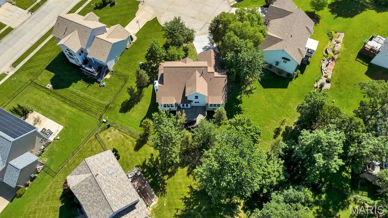 Expansive property with architectural detail  featuring a light-colored exterior and a brown shingle roof — 1103 Panda Court, Wentzville, MO 63385