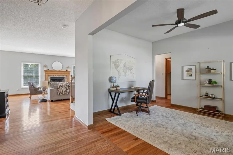 Dedicated office space featuring hardwood flooring and a ceiling fan — 195 England Drive, O'Fallon, MO 63366