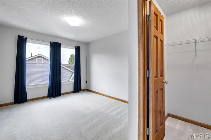 Upstairs bedroom with walk-in closet — 195 England Drive, O'Fallon, MO 63366