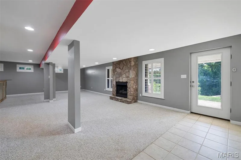 finished basement with gas fireplace — 195 England Drive, O'Fallon, MO 63366