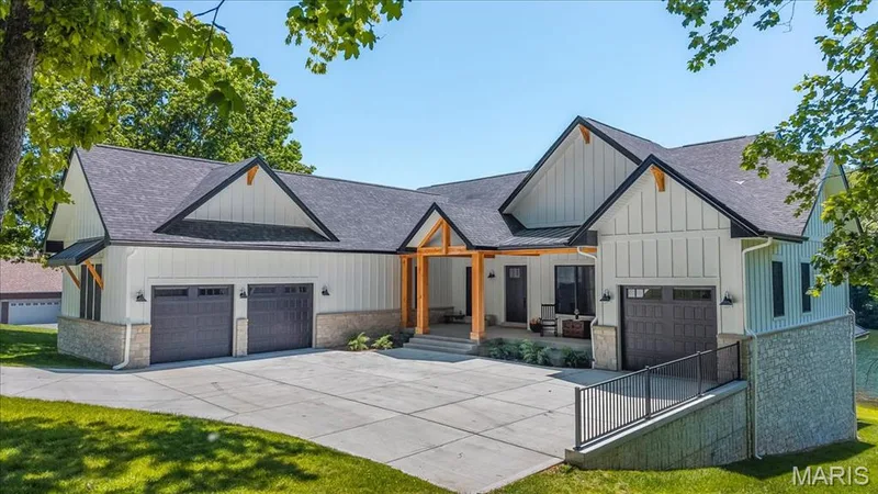 2-car oversized garage on one side and aa 1-car garage on the other side of the home.  Bring on those big trucks/vehicles! — 4444 Augusta Shores Drive, Augusta, MO 63332