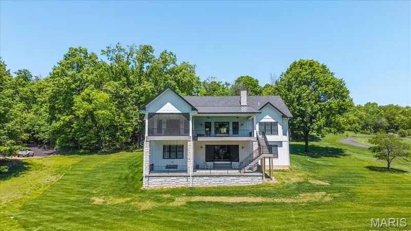 Enjoy the outdoors but stay out of the rain on either level with the covered porches.  The screened porch offers outdoor enjoyment with no bugs! — 4444 Augusta Shores Drive, Augusta, MO 63332