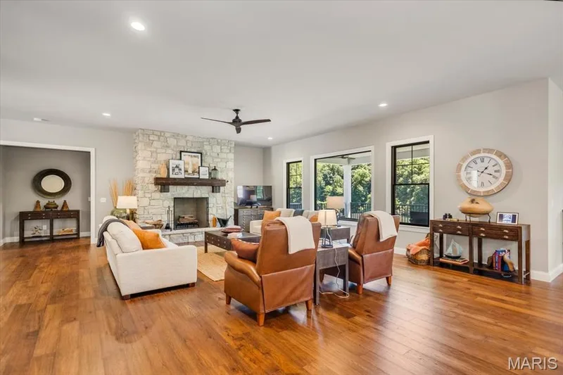 The stone fireplace is definitely a focal point of this room — 4444 Augusta Shores Drive, Augusta, MO 63332