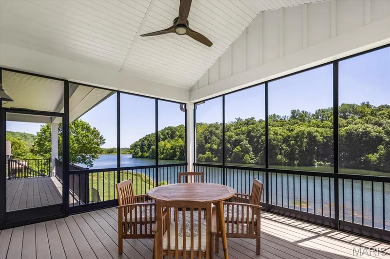 Raining?  Mosquitos?  Don't worry, your covered in this screened porch with unbelievable views of the main lake — 4444 Augusta Shores Drive, Augusta, MO 63332