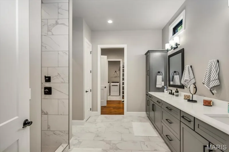 Primary ensuite with dual vanities with tons of storage, walk-in shower, and a separate potty room — 4444 Augusta Shores Drive, Augusta, MO 63332
