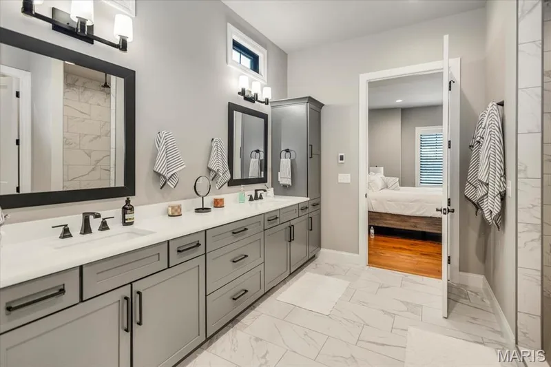 The floor in the Primary ensuite is heated, so your feet will stay nice and toasty — 4444 Augusta Shores Drive, Augusta, MO 63332