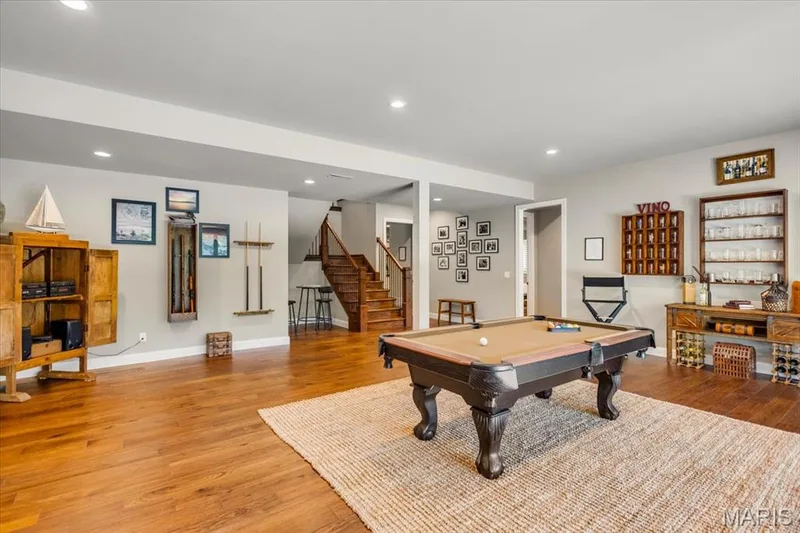 Another view of the Recreation Room in the Lower level - the doorway to the right leads to two bedrooms, a jack and jill bathroom, and a gym/exercise room — 4444 Augusta Shores Drive, Augusta, MO 63332