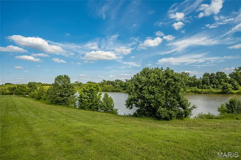 Beautiful community lake for your evening strolls — 7313 Cinnamon Teal Drive, O'Fallon, MO 63368