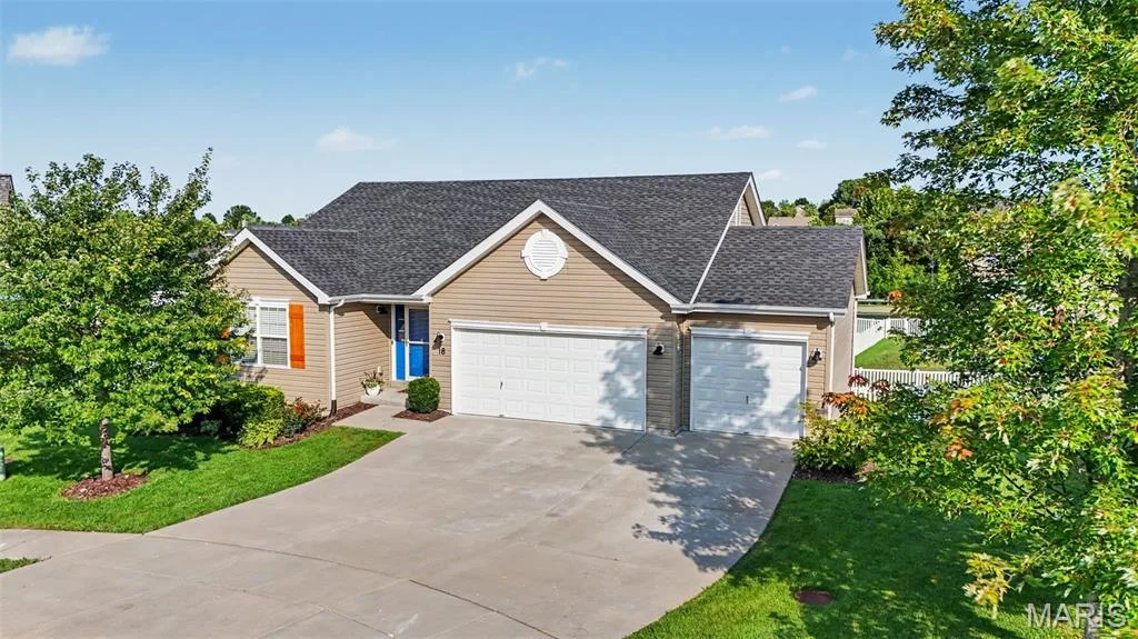 Inviting front exterior showcasing a spacious 3-car garage — 18 Sonnet Way Court, Wentzville, MO 63385