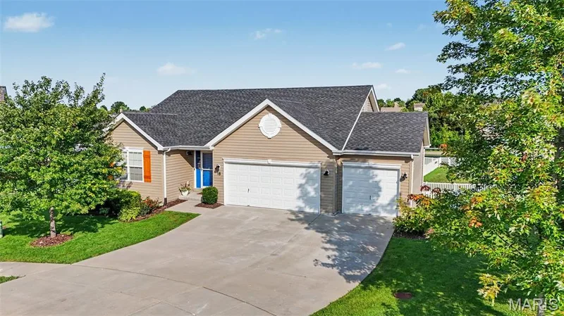 Inviting front exterior showcasing a spacious 3-car garage — 18 Sonnet Way Court, Wentzville, MO 63385