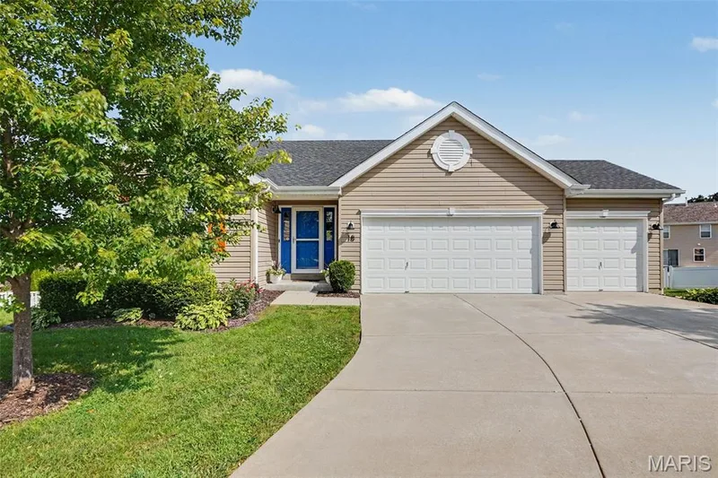 Inviting front exterior showcasing a spacious 3-car garage — 18 Sonnet Way Court, Wentzville, MO 63385