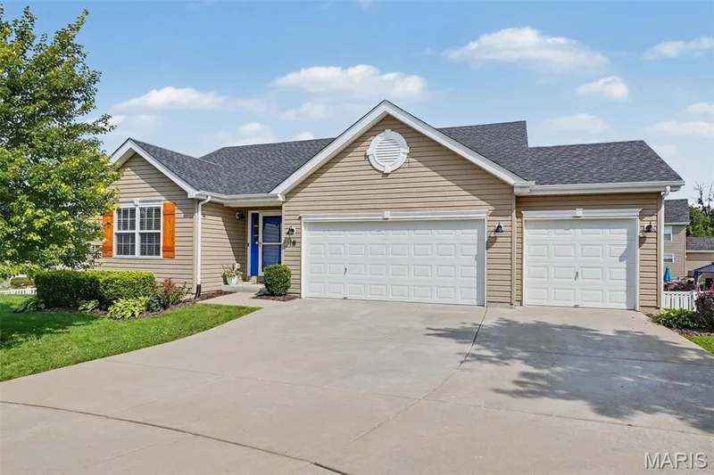 Inviting front exterior showcasing a spacious 3-car garage — 18 Sonnet Way Court, Wentzville, MO 63385