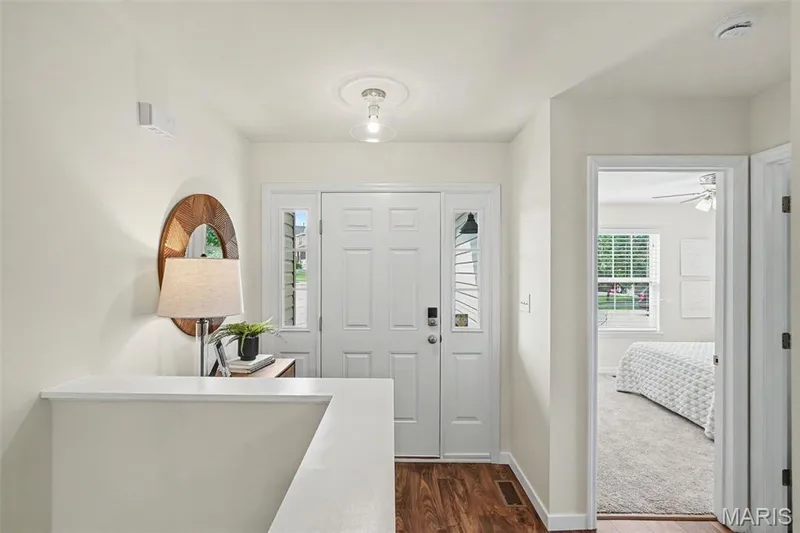 Entryway featuring LVP, and a new contemporary ceiling light fixture — 18 Sonnet Way Court, Wentzville, MO 63385