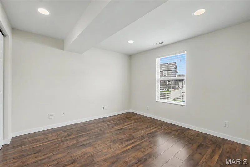 Lower-level 4th bedroom with LVP flooring — 18 Sonnet Way Court, Wentzville, MO 63385