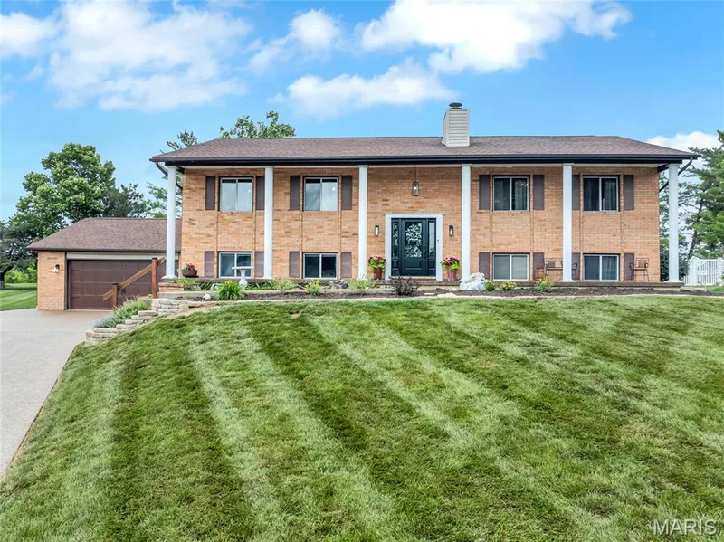 This stately home features 6 bedrooms and a 1150 sq foot garage — 16 La Rochelle Court, Lake St. Louis, MO 63367