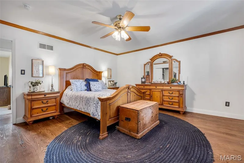 Sleep well in the Primary Bedroom which includes beautiful solid oak flooring and fresh paint. — 16 La Rochelle Court, Lake St. Louis, MO 63367