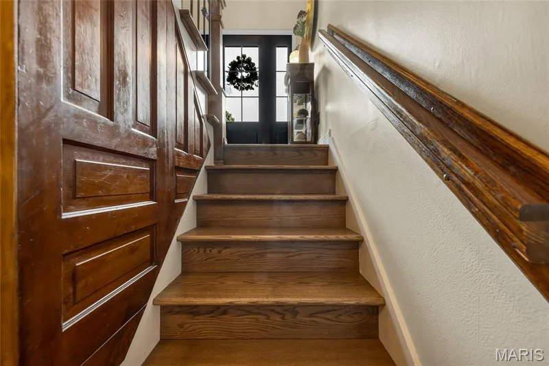 Solid wood stairs to lower level — 16 La Rochelle Court, Lake St. Louis, MO 63367
