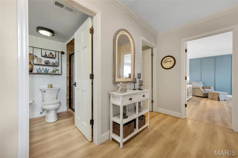 Hallway to Family Room, Bathroom, Laundry Room, Bedrooms — 16 La Rochelle Court, Lake St. Louis, MO 63367