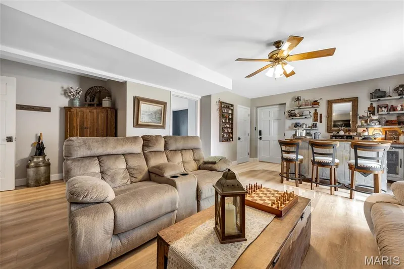 Great size Family Room with walk out to patio and garage. New LVT flooring — 16 La Rochelle Court, Lake St. Louis, MO 63367