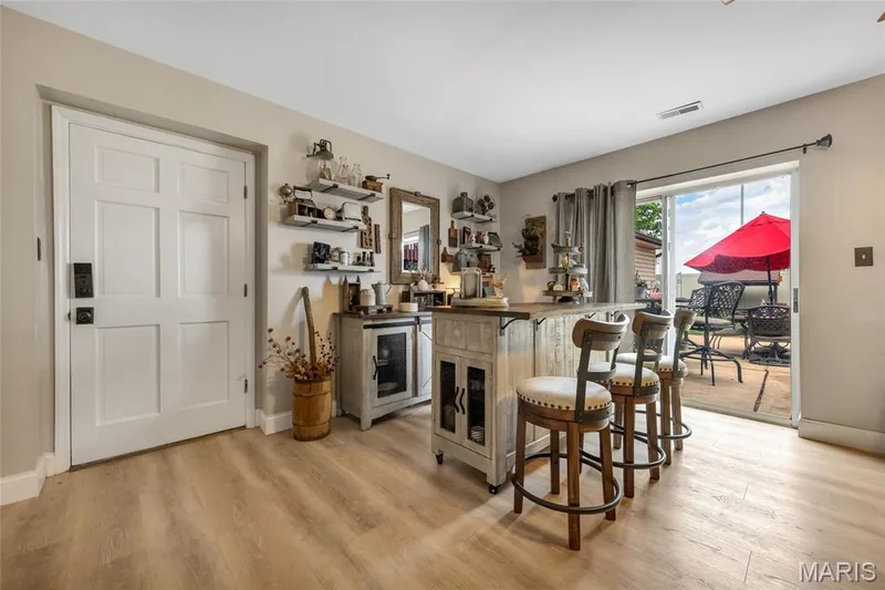 Family Room with patio and garage access — 16 La Rochelle Court, Lake St. Louis, MO 63367