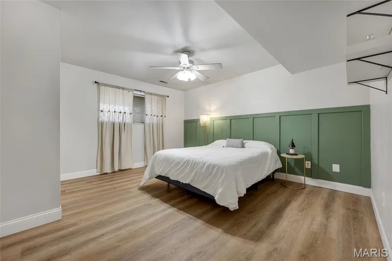 Bedroom #5 with accent wall, new flooring and paint — 16 La Rochelle Court, Lake St. Louis, MO 63367