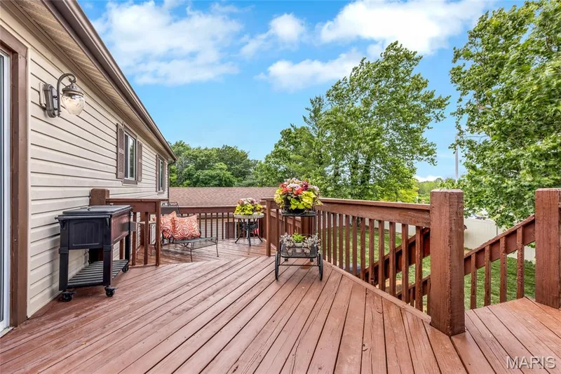 Deck with stairs to yard — 16 La Rochelle Court, Lake St. Louis, MO 63367