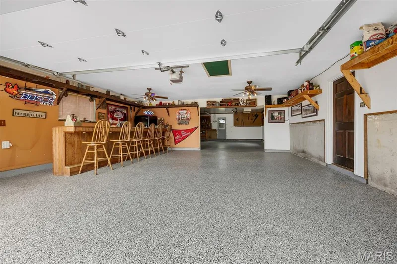 It's a party in the front and business in the back! Brand new epoxy resin floor! — 16 La Rochelle Court, Lake St. Louis, MO 63367