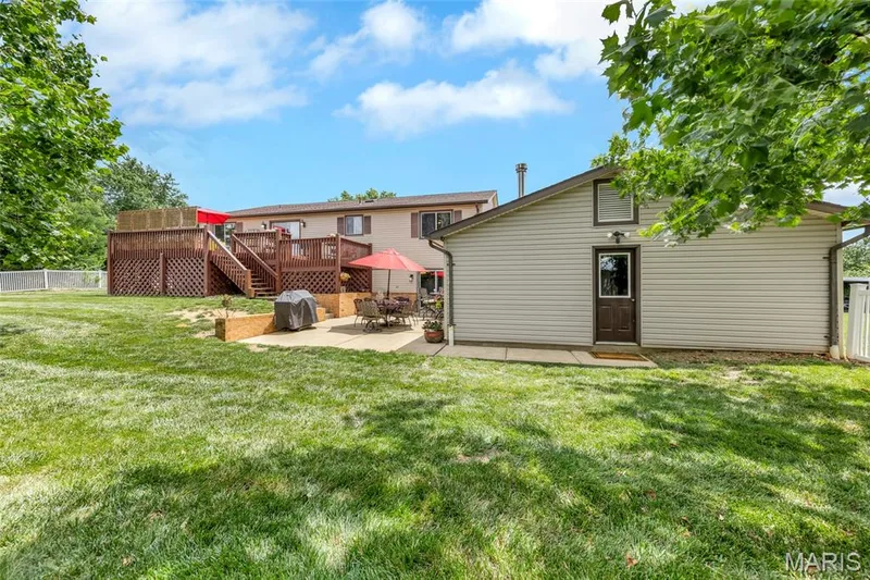 Back of home with large yard — 16 La Rochelle Court, Lake St. Louis, MO 63367