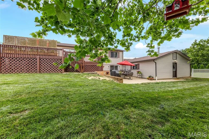 Fenced yard with 4' vinyl fence featuring one single gate and one double gate! — 16 La Rochelle Court, Lake St. Louis, MO 63367
