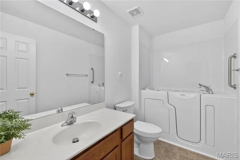 Hall bath with luxury step-in tub — 403 Newport Drive, St Peters, MO 63376