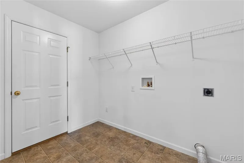 Main floor laundry room connects to garage — 403 Newport Drive, St Peters, MO 63376