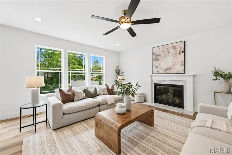 Great Room with 9 Foot Ceilings, Luxury Vinyl Plank Flooring, Gas Fireplace and Window Wall — 527 Ryehill Drive, St Peters, MO 63376