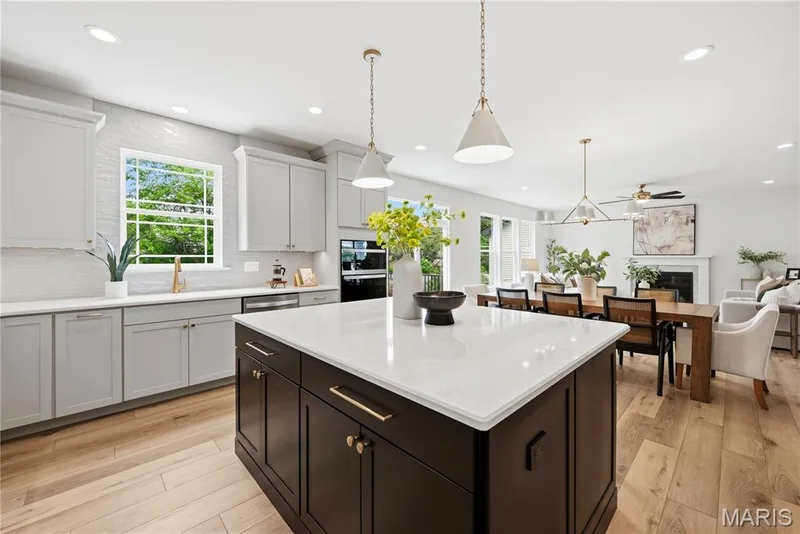 Kitchen open to Breakfast Room and Great Room with 9 Foot Ceilings and Luxury Vinyl Plank Flooring — 527 Ryehill Drive, St Peters, MO 63376
