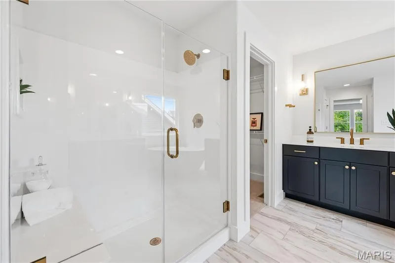 Shower with Frameless Shower Doors and Seat in Luxury Primary Bath — 527 Ryehill Drive, St Peters, MO 63376