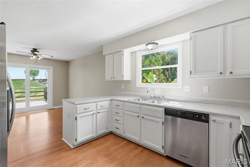 Spacious eat in kitchen with recently replaced sliding door to deck — 814 Emerald Place Drive, St Charles, MO 63304