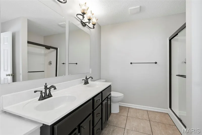 Dual vanity with white countertops — 814 Emerald Place Drive, St Charles, MO 63304
