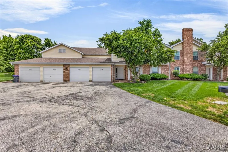 Multi-unit property featuring a combination of brick and siding exteriors — 1034 Windstream Drive #14, St Peters, MO 63376